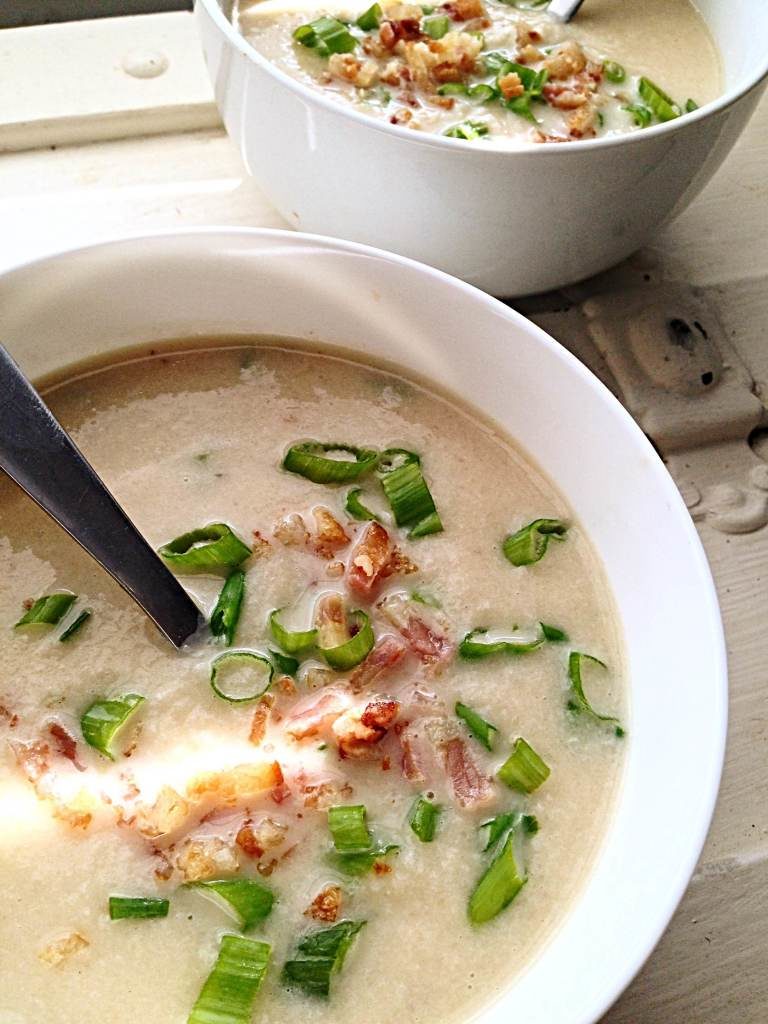 bowls of cauliflower soup with bacon