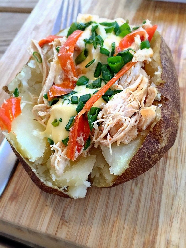 slow cooker philly chicken on baked potato