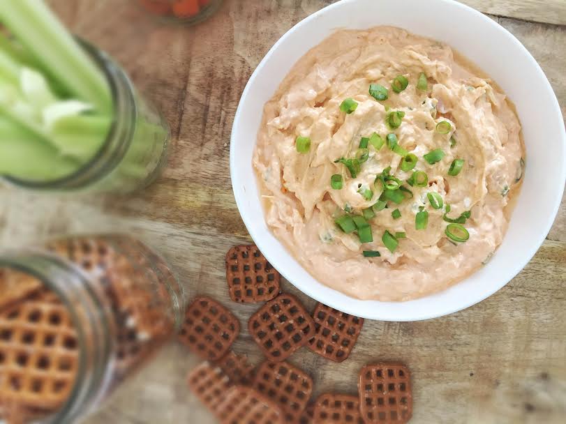 Buffalo Chicken Dip with celery and pretzels