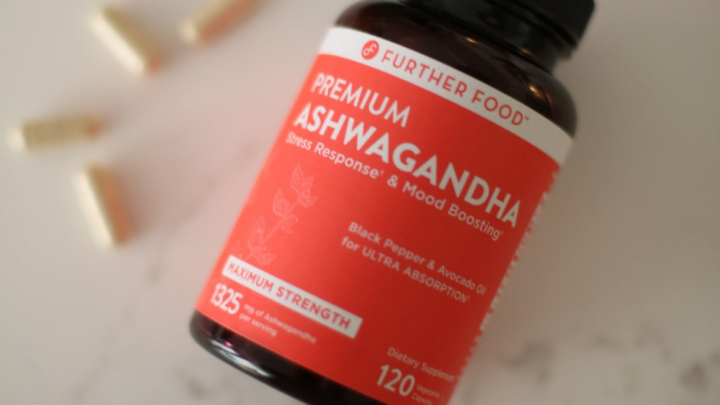 bottle of Further Food premium ashwagandha with pills on table